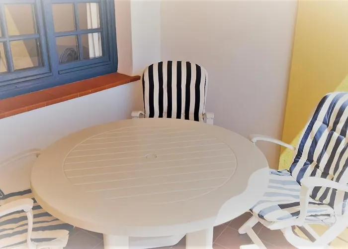 K105 Cabopino Апартаменти